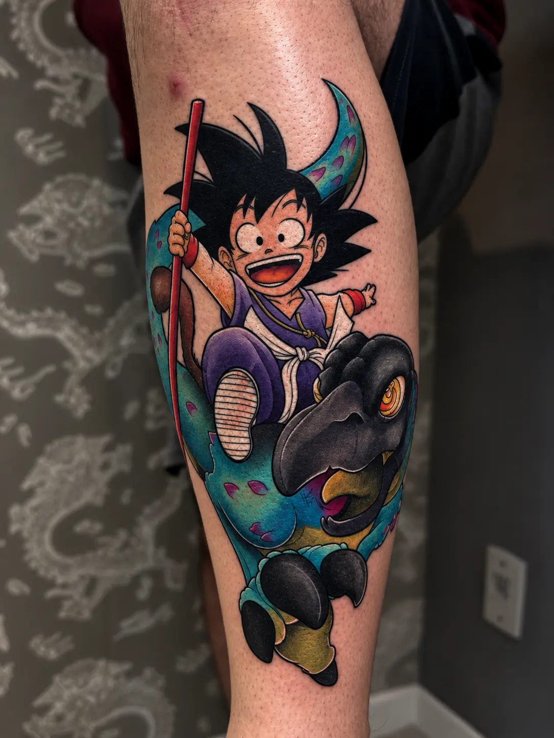 Tatuagem anime colorida do Goku por Cascio